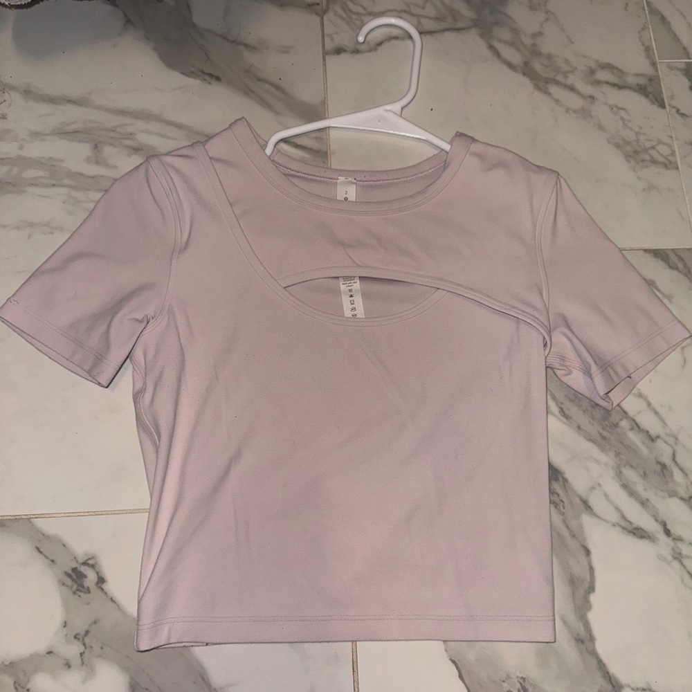 Baby pink lululemon cropped shirt. Size 2. Good condition